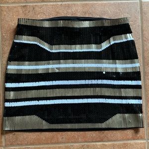 Express tight mini skirt perfect for holiday parties! 13.5” in length.